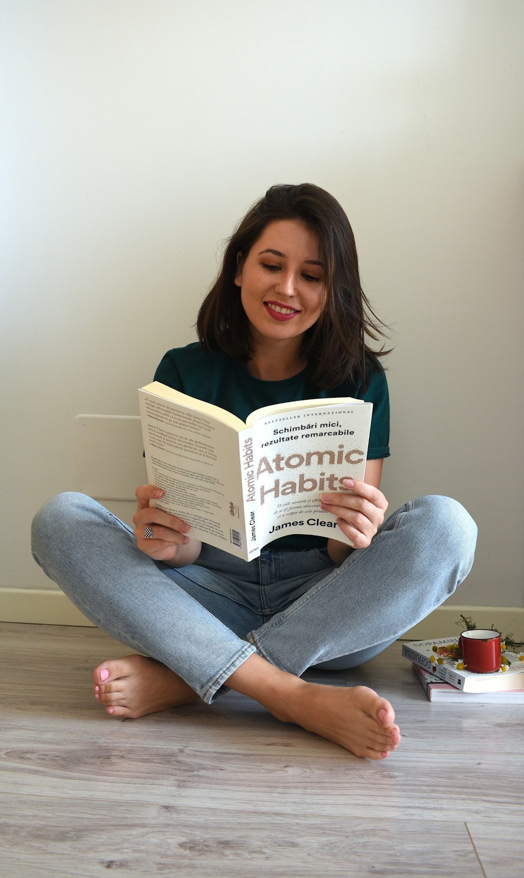 actress reading book at home