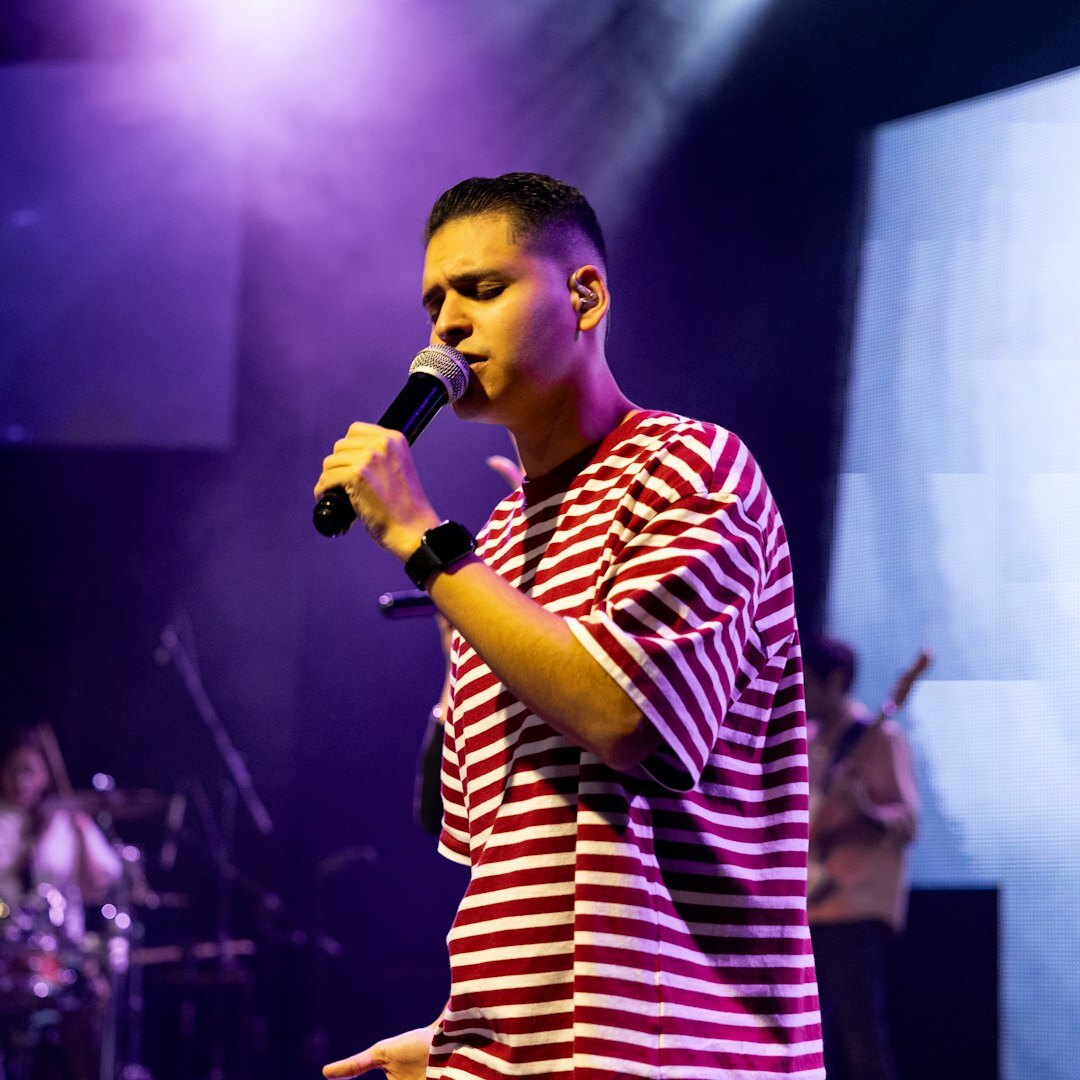 latino singer on stage performing